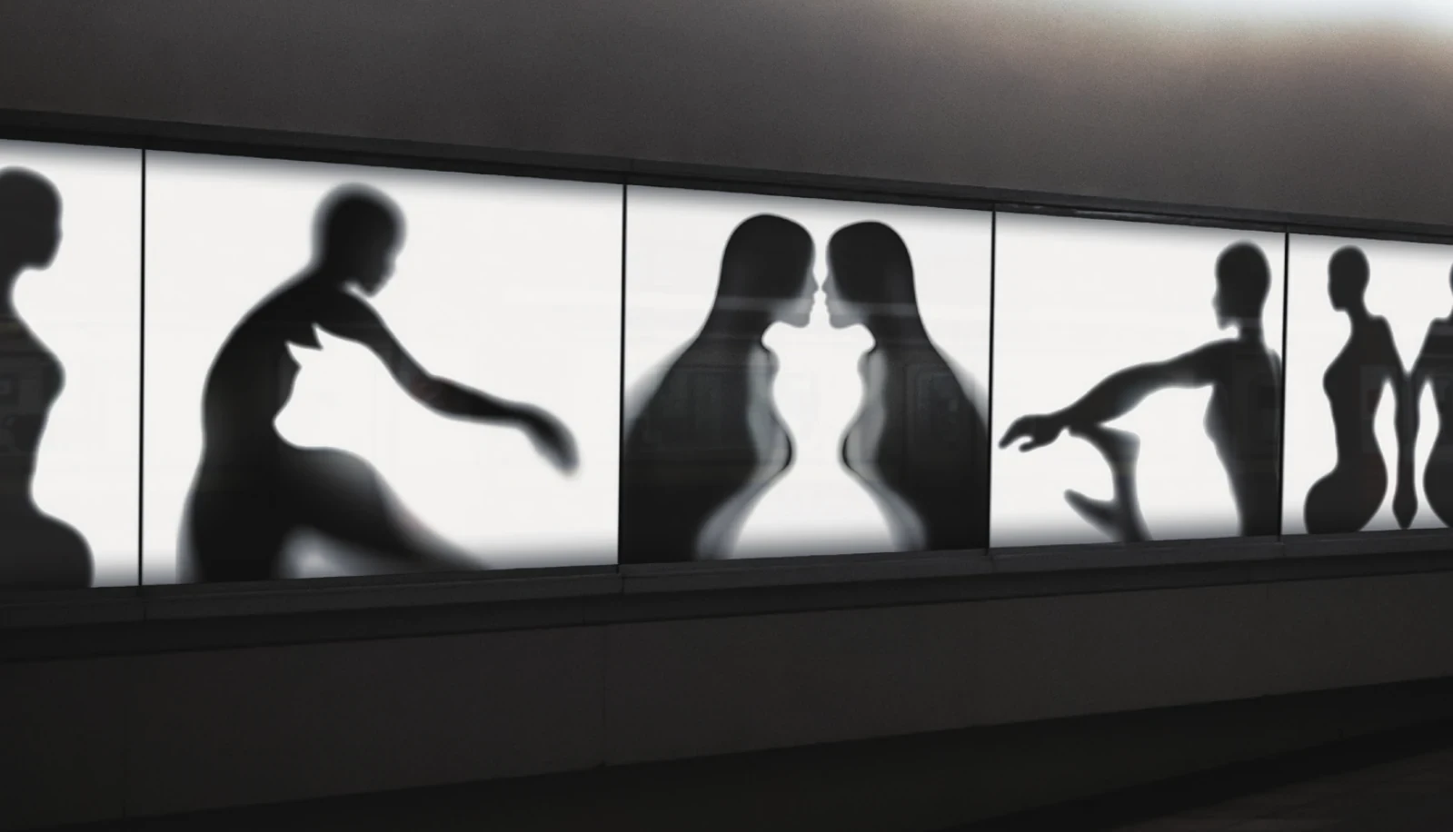 Figure–ground silhouettes across illuminated exhibition panels