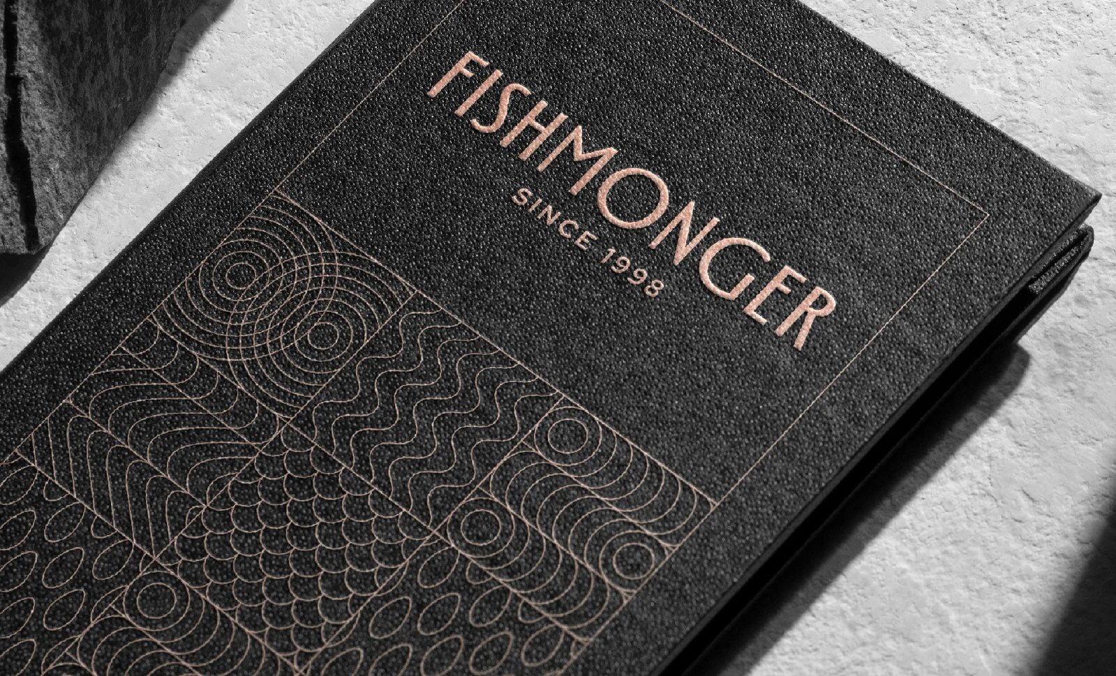 The Fishmonger menu with a modular wave pattern