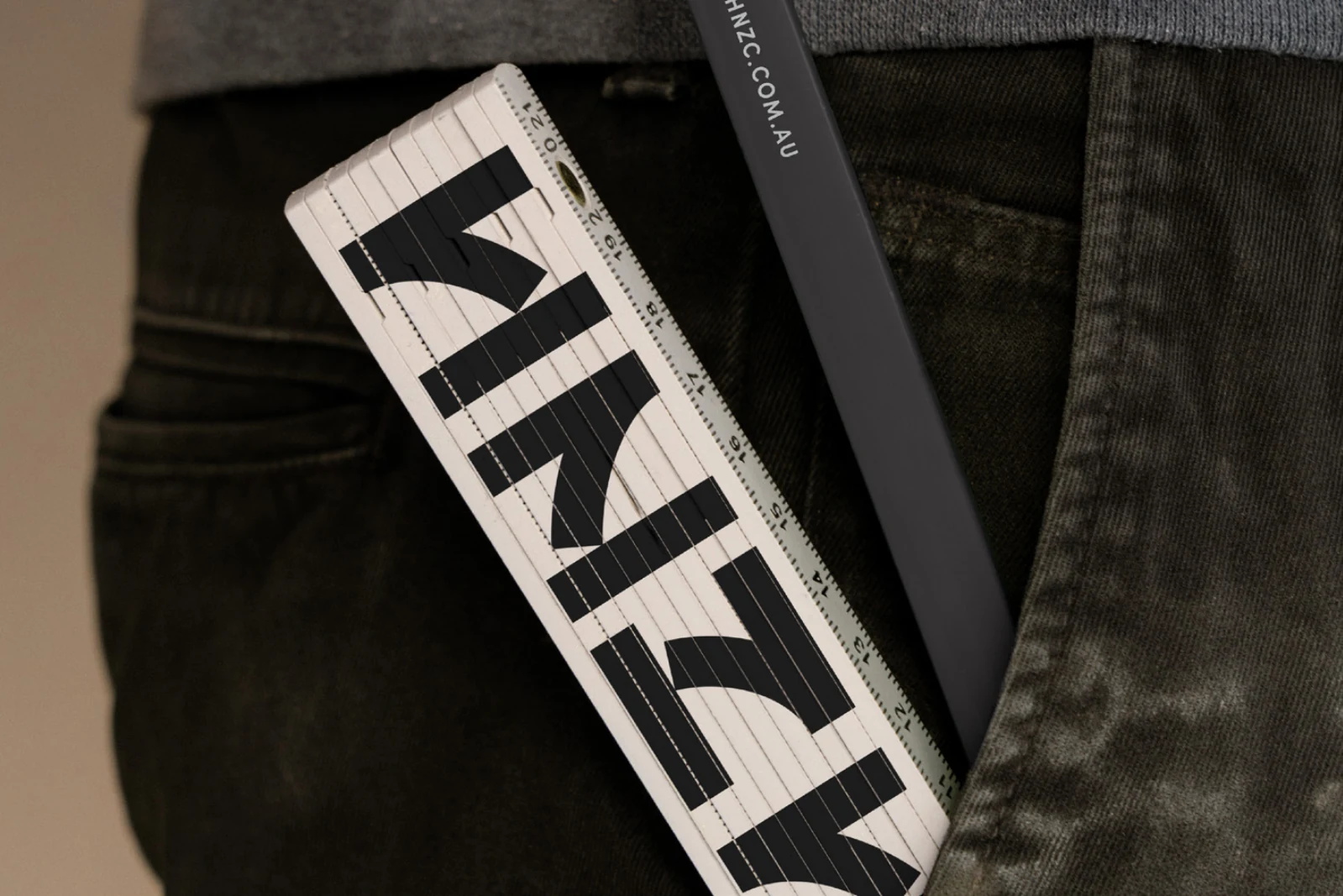 HNZ lettering on a ruler tucked into a pocket