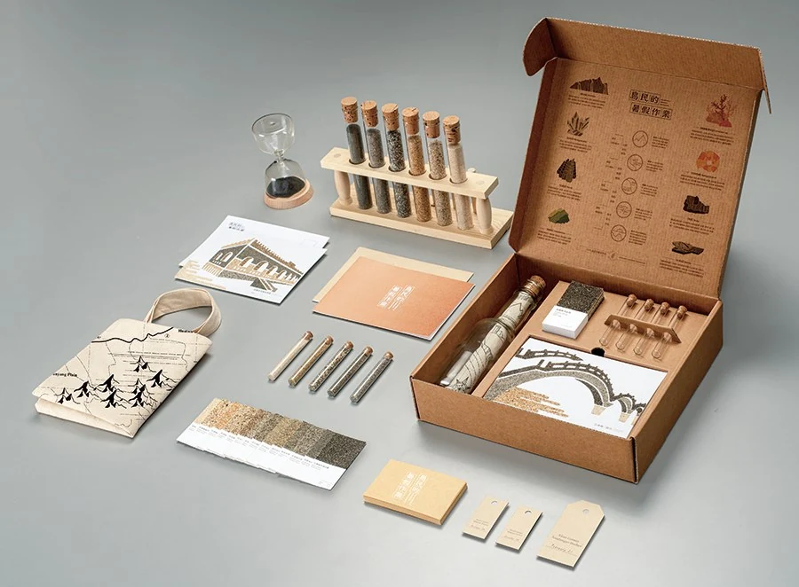 The Islander’s Summer Homework toolkit with its open box, sand samples, postcards and fieldwork objects